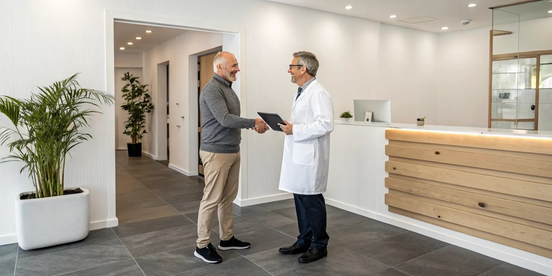Chiropractor adding an associate to the practice with a welcoming handshake.