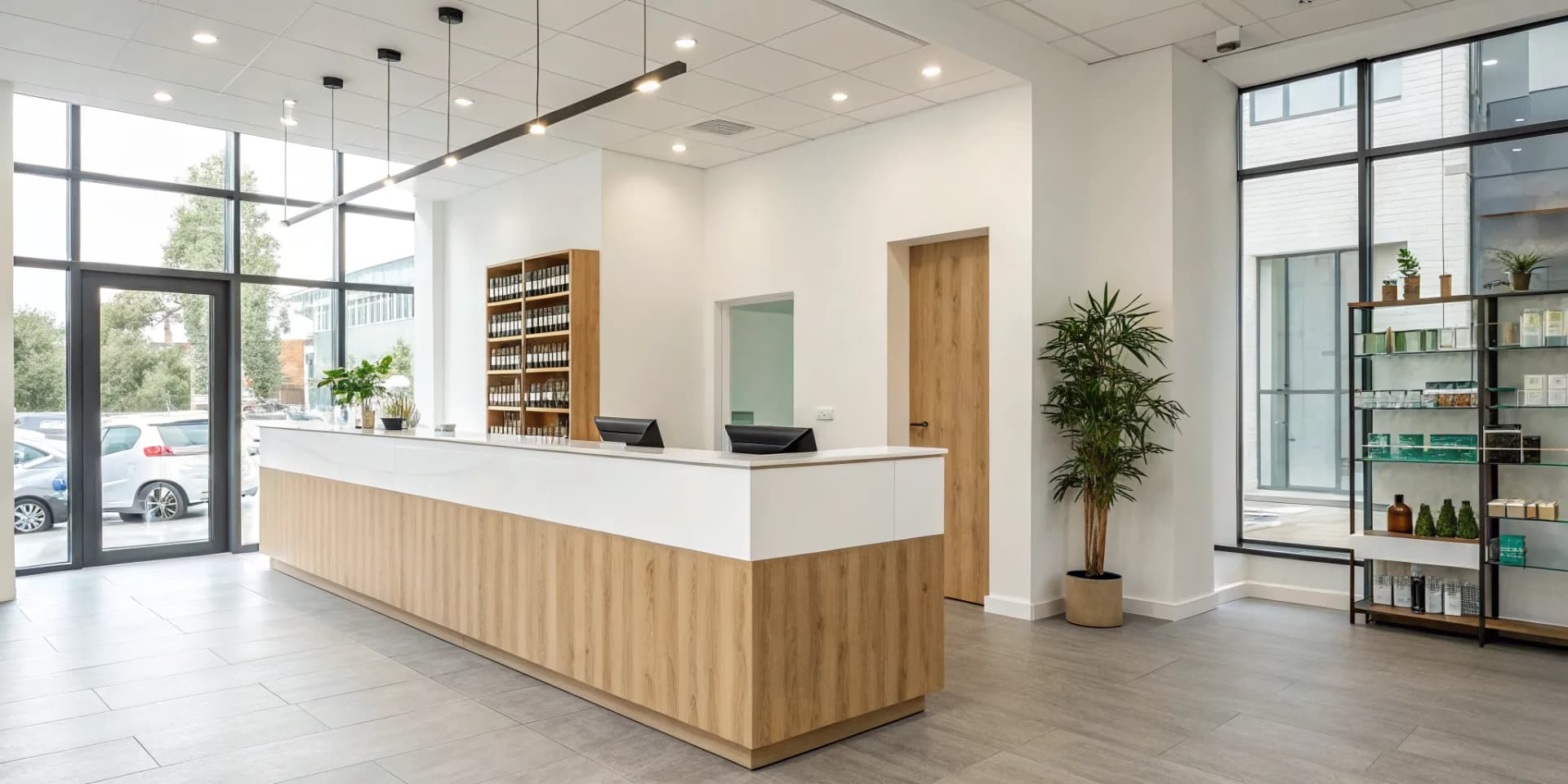 A chiropractic clinic adds revenue streams by selling wellness products in its modern reception area.