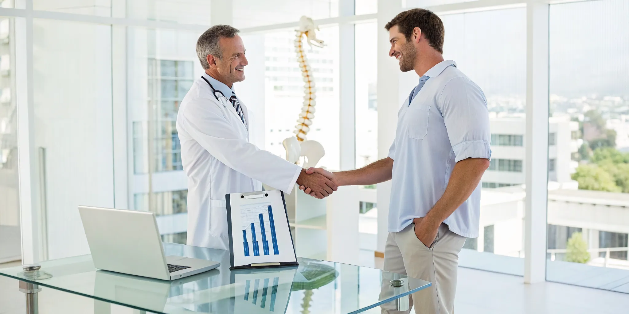Chiropractor shaking hands with a patient, a strategy to grow a successful chiropractic franchise.