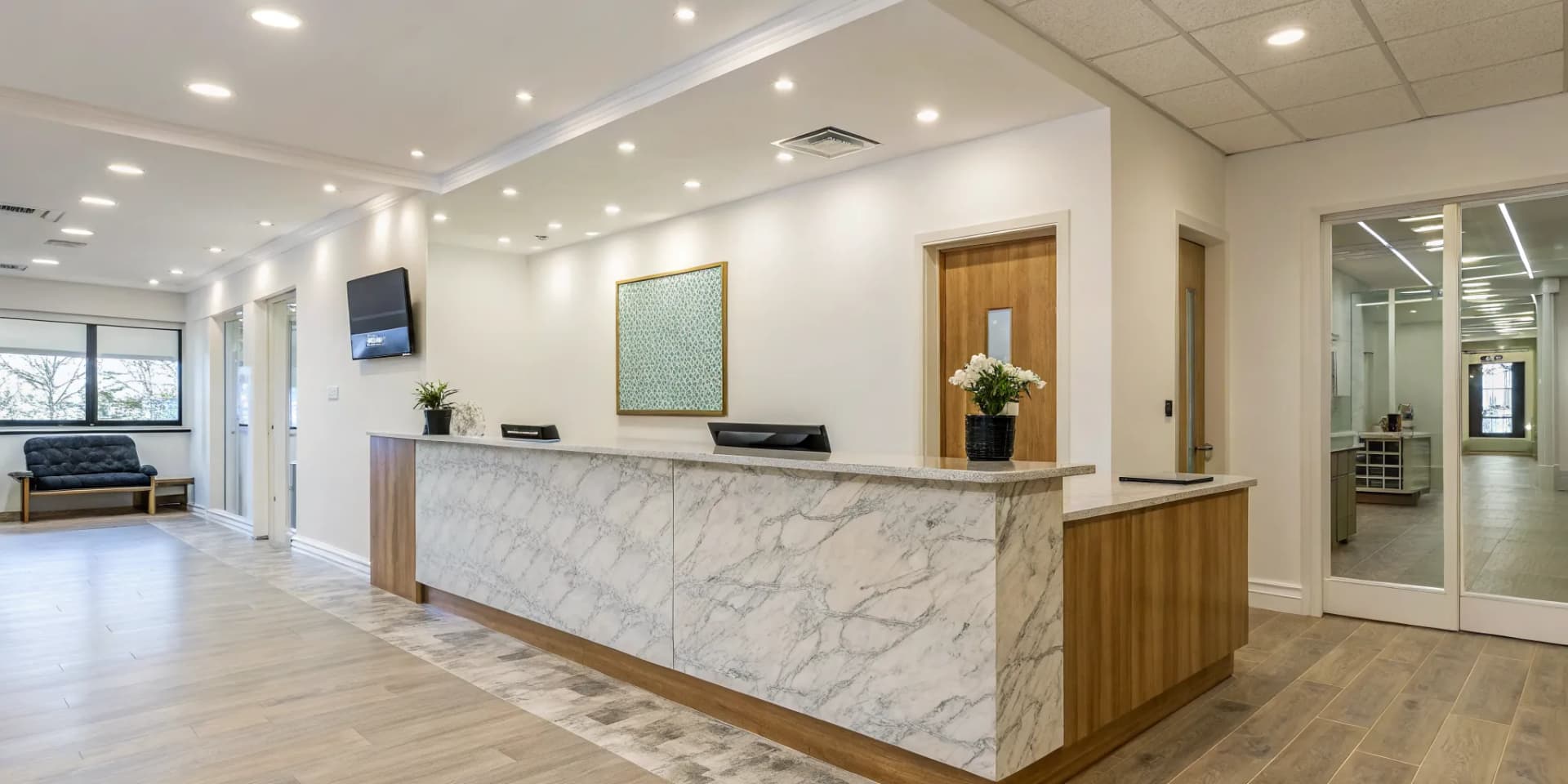 The modern reception area of a profitable chiropractic franchise.